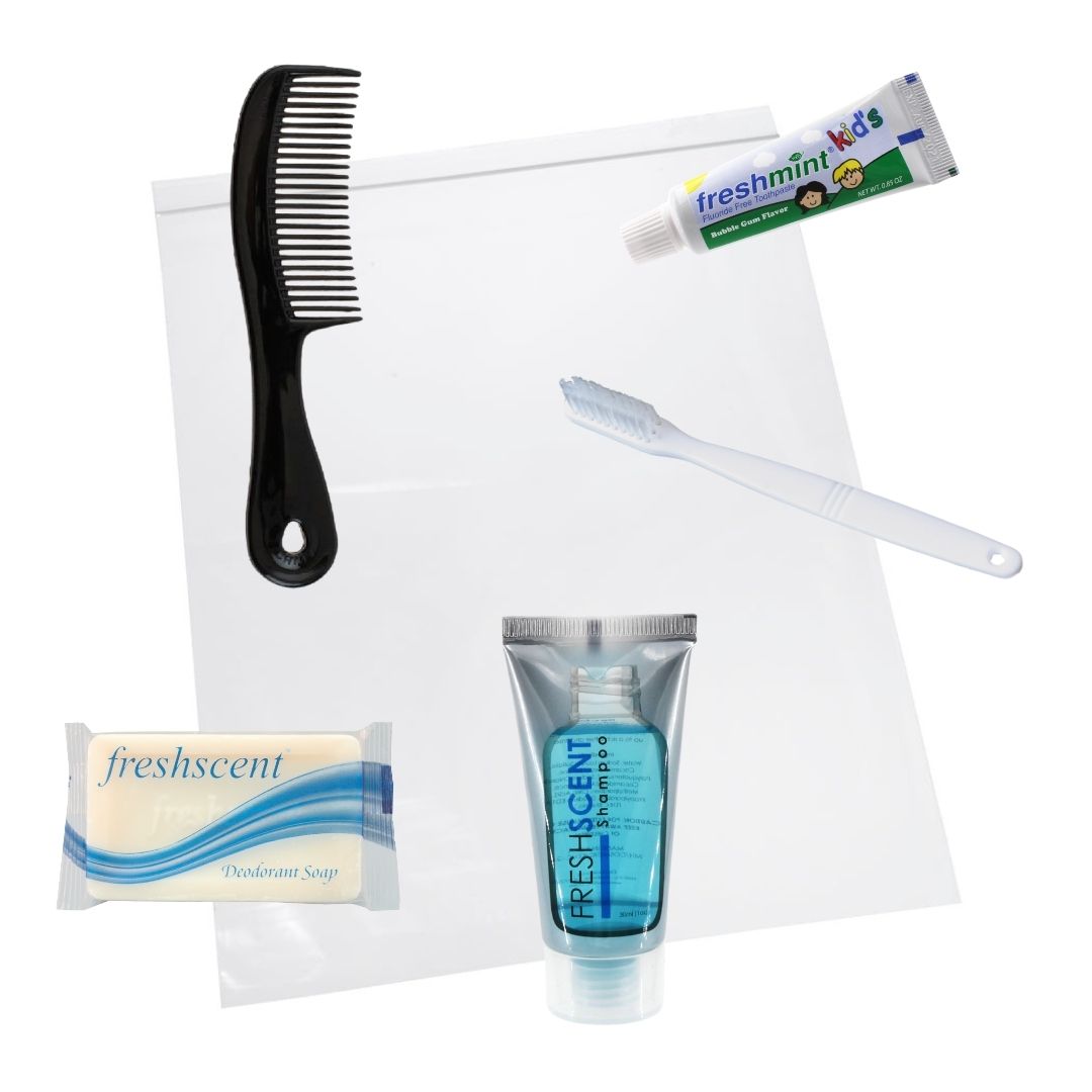 A zip-close bag with hygiene kit a black handle comb, toothbrush, toothpaste, shampoo/body wash, and a soap bar inside.